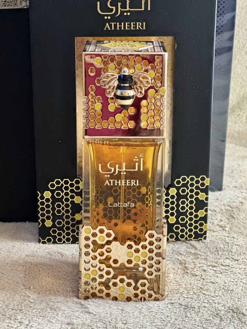 Authentic Lattafa Atheeri Perfume (Category: Fragrance & Deodorants) located in Manila. Submitted by aly_tan0903 (Listing ID 1457853776, Image 3). Description: - Lattafa Atheeri Eau de Parfum - Full bottle, never used - Fragrance Profile: Warm and sweet aroma - Exquisite bottle design: Features a bee motif with honeycomb accents - Ideal for gifting or personal indulgence - A unique and captivating scent.