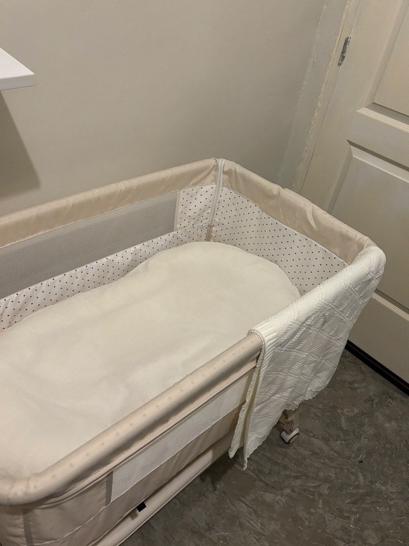 Baby crib/bassinet (Category: Cots & Cribs) located in Caloocan City. Submitted by yangcmt (Listing ID 1457717716, Image 2). Description: We didn't use it, we decided to cosleep - Adjustable height for your growing baby - Comes with a mosquito net to protect your little one - Convenient storage basket underneath for essentials - Mesh panels on sides ensure good airflow - Wheels allow for easy movement around the room - Mattress included for immed
