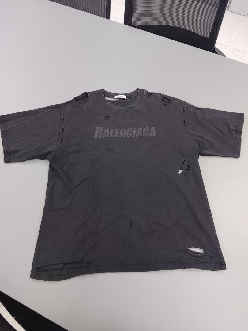 Balenciaga Distressed Logo Shirt (Category: Luxury Apparel) located in Pasig City. Submitted by thriftshop.pinas (Listing ID 1457799957, Image 2). Description: Balenciaga Distressed Logo Shirt -Size: Large on tag best fit to XL -Dimes: 24 x 30 -Condition: Good condition -Complete Tags -No issue at all.