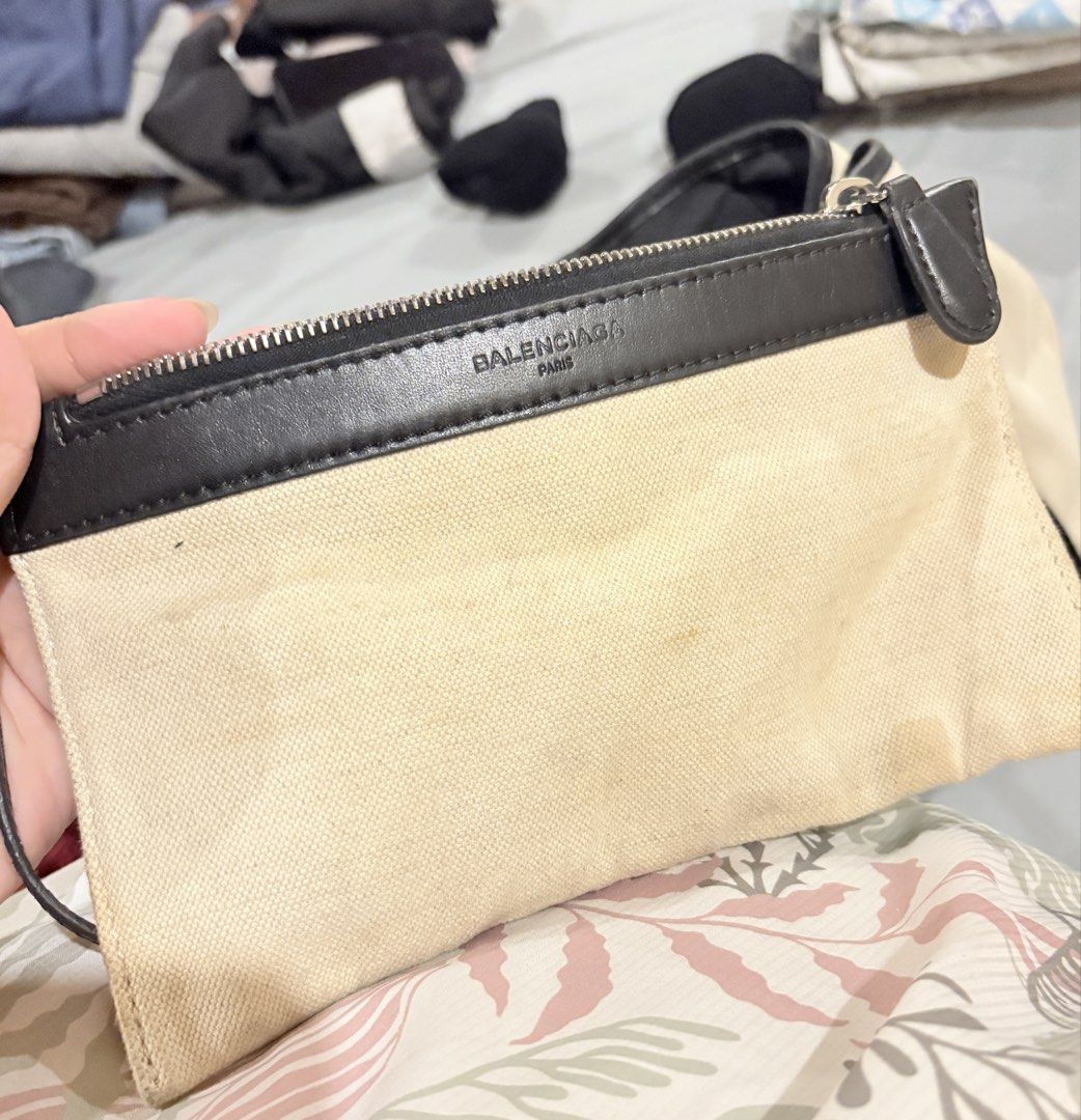 Balenciaga Paris Canvas Tote Bag (Category: Luxury Bags & Wallets) located in Caloocan City. Submitted by fierce_mica29 (Listing ID 1457715365, Image 2). Description: - Balenciaga Paris tote bag - Color: Cream canvas with black leather trim - Closure: Top zipper - Includes: Separate zippered pouch - Condition: Minor marks on canvas (especially pouch), zipper pull shows wear - Perfect for everyday use .