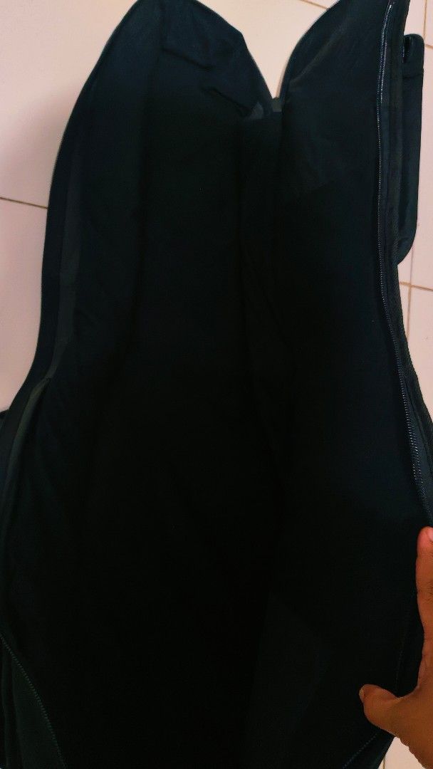 Black Padded Guitar Gig Bag with Pockets (Category: Musical Instruments) located in Bulacan. Submitted by babz30261 (Listing ID 1457740484, Image 2). Description: - Black padded gig bag for guitars - Large front pocket for accessories - Smaller pocket near the top - Secure zipper closure - Adjustable shoulder straps - Convenient carrying handle - Excellent protection for your instrument during transport.