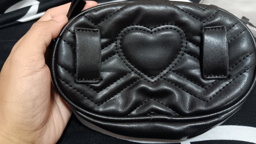 Gucci Belt Bag (Category: Luxury Bags & Wallets) located in Cavite. Submitted by saycolonia29. (Listing ID 1457726816, Image 3). Description: May flaws na po sa Gucci logo sa front, nabura na din ang Gucci Made in Italy at may sira sa belt see on pictures. Pero super ganda pa ng loob at leather sa labas. No inclusions na po, bag lang talaga pero from Dubai yan - Black quilted belt bag - Iconic gold GG logo hardware - Cute heart detail on the back