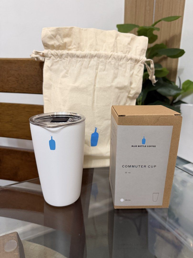 Blue Bottle Coffee Cold Brew Bottle & Commuter Cup Set (Category: Water Bottles & Tumblers) located in Muntinlupa City. Submitted by milkypugsley (Listing ID 1457743417, Image 2). Description: - Blue Bottle Coffee cold brew bottle (clear with blue lid) - Blue Bottle Coffee commuter cup (white with blue logo) - Includes original boxes - Comes with a drawstring bag (commuter cup only) - Ideal for coffee lovers on the go.