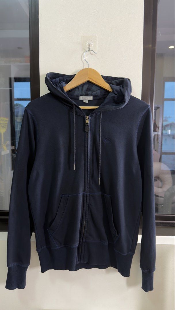 Burberry Black Hoodie with TB Monogram Back (Category: Luxury Apparel) located in Paranaque City. Submitted by preluxeshop_ph (Listing ID 1457831405, Image 2). Description: Burberry Black Hoodie with TB Monogram Back - Size: L - Design: Features the iconic TB monogram on the back - Origin: Made in Italy - Material: 100% Cotton with 5% Elastane for a comfortable fit - Style: Ideal for casual wear and everyday styling - Condition: Please refer to t