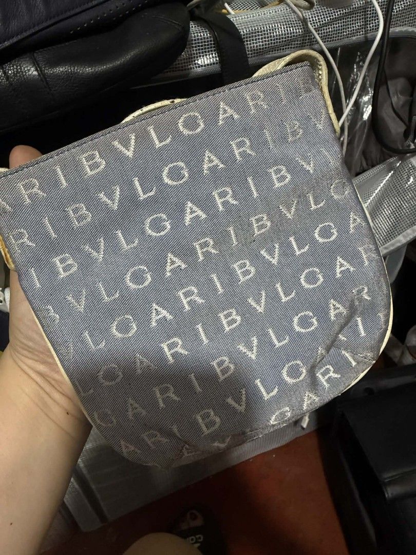 Bvlgari Monogram Canvas Pouch (Category: Luxury Bags & Wallets) located in Manila. Submitted by cruznarlyn63507 (Listing ID 1457846254, Image 1). Description: - Authentic Bvlgari pouch - All-over BVLGARI logo pattern - Color: Light blue canvas with cream trim - Closure: Zipper - Interior: Bright green fabric lining - Features: Small chain attached to zipper pull - Ideal for organizing small essentials.