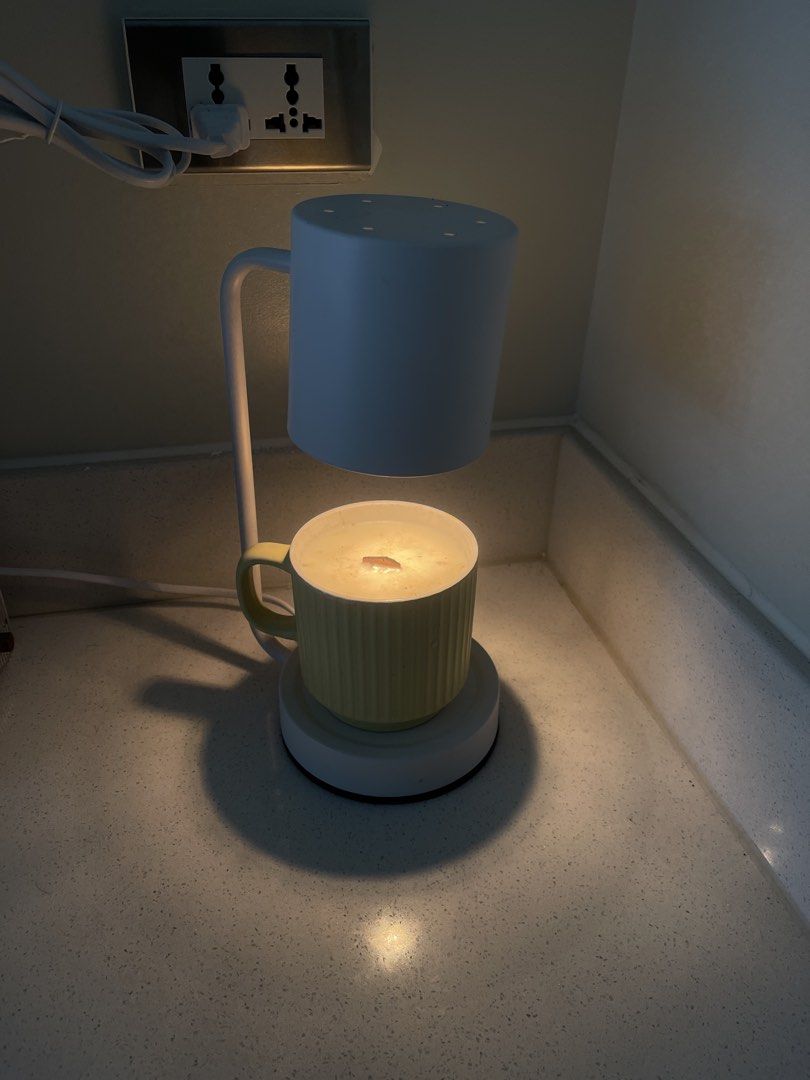 Candle Warmer Lamp with Mug and Candle (Category: Other Home Decor) located in Quezon City. Submitted by Mike_0 (Listing ID 1457749691, Image 1). Description: Selling our Candle light with warmer Oat scented 1200 only for the set For the breakdown Candle warmer - 1k Scented candle - 500 Bulb - 200 Location - Cypress Village Cainta near Junction / Proj 4 Cubao QC.