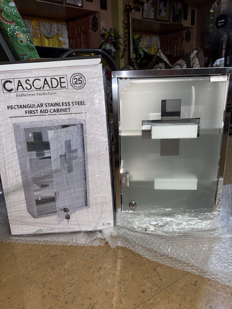 Cascade Rectangular Stainless Steel First Aid Cabinet (Category: Shelves, Cabinets & Racks) located in Manila. Submitted by terefficstuffs (Listing ID 1457772951, Image 1). Description: - Brand new Cascade First Aid Cabinet - Durable stainless steel construction - Elegant frosted glass door with a prominent cross design - Two internal shelves for organized storage - Secure lock with included key - Ideal for both home and office environments - Kee