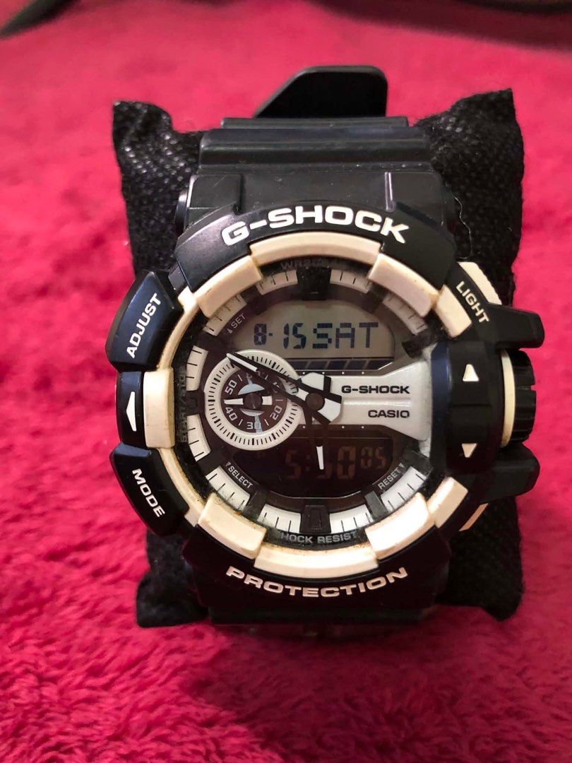 Casio G-Shock GA-400-1A (Category: Men's Watches) located in Rodriguez. Submitted by gentlecloud.6f4dfa (Listing ID 1457884420, Image 1). Description: - Black and white G-Shock watch - Shock resistant and protective - Digital display for time and date - Features mode, adjust, select, and light buttons - Perfect for everyday wear or sports activities.