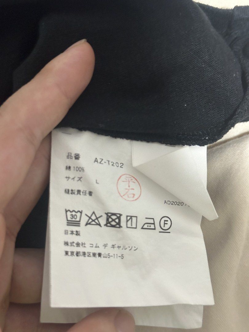 Cdg Play shirt (Category: Tshirts & Polo Shirts ) located in Subic. Submitted by declutterbyshit (Listing ID 1457888921, Image 3). Description: - Brand: PLAY COMME des GARÇONS AUTHENTIC MONEY BACK IF FAKE - Size: L (28x20) - Material: 100% Cotton - Features: Iconic small heart logo on chest - Style: Versatile staple piece, easy to pair with anything.
