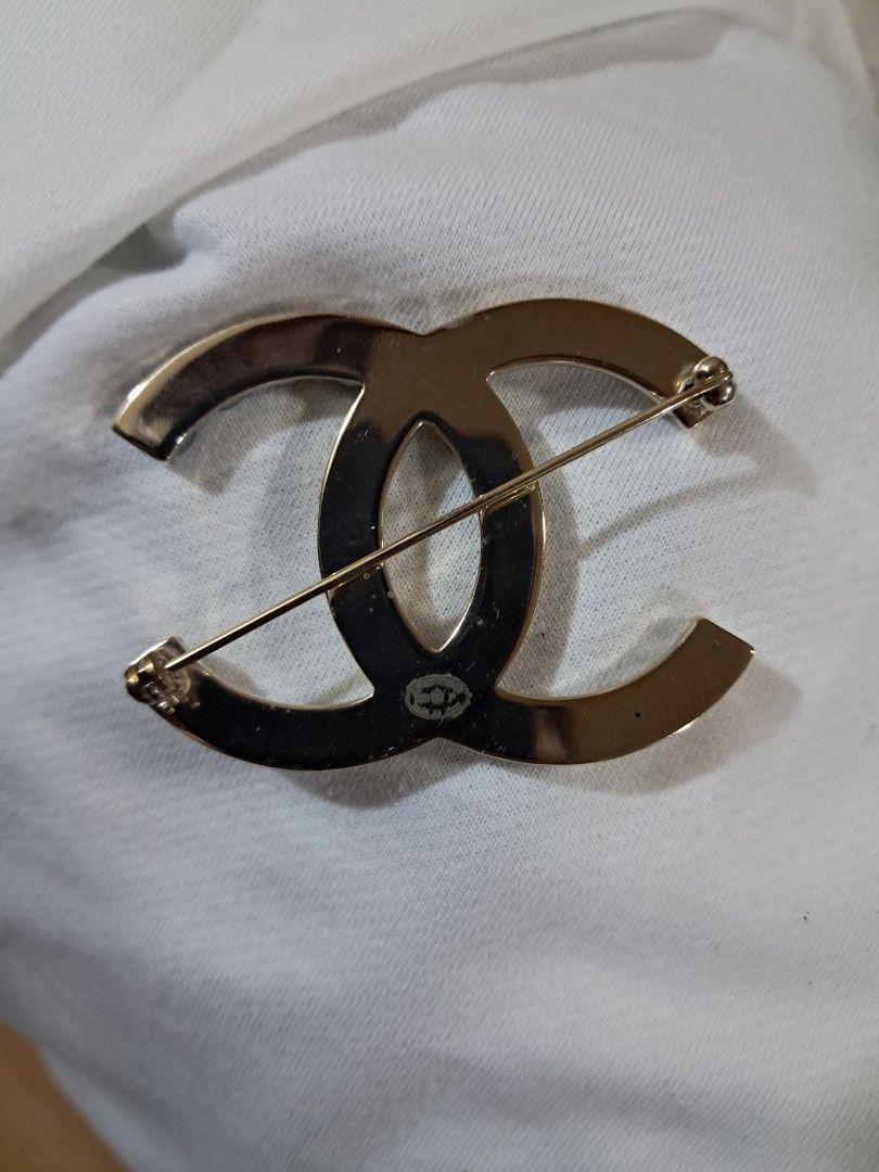 Chanel CC Brooches (Sold separately) (Category: Brooches) located in Quezon City. Submitted by melmgpy (Listing ID 1457452310, Image 3). Description: - Authentic Chanel brooches, perfect statement pieces. - Available styles: - Gold with pearls and crystals. - Gold with crystals spelling 'CHANEL'. - Silver with crystals and chains spelling 'CHANEL'. - All brooches come in their original boxes..