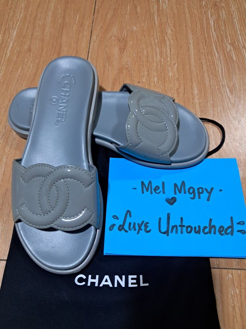 Chanel CC Logo Slides Grey (Category: Sneakers & Footwear) located in Quezon City. Submitted by melmgpy (Listing ID 1457466239, Image 2). Description: - Authentic Grey Chanel Slides - Iconic CC Logo - Made in Italy - Super Comfy and Stylish - Perfect for Casual Wear or a Day Out - A Must-Have Addition to Your Collection.