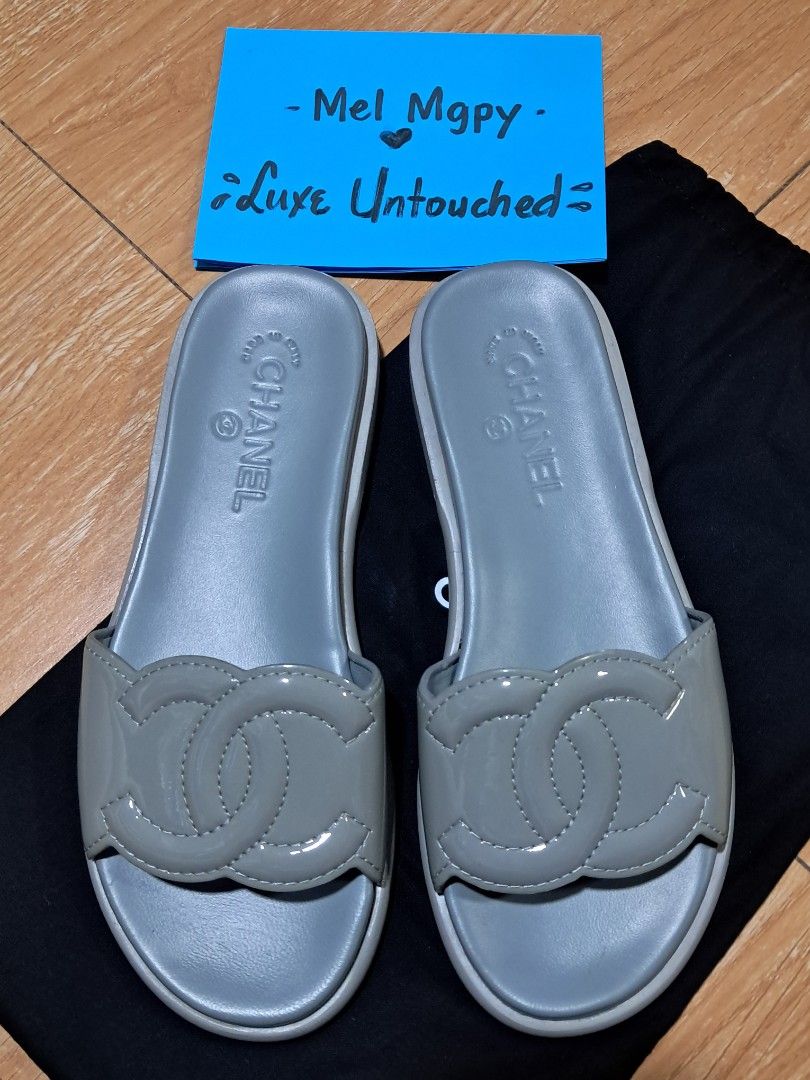 Chanel CC Logo Slides Grey (Category: Sneakers & Footwear) located in Quezon City. Submitted by melmgpy (Listing ID 1457466239, Image 3). Description: - Authentic Grey Chanel Slides - Iconic CC Logo - Made in Italy - Super Comfy and Stylish - Perfect for Casual Wear or a Day Out - A Must-Have Addition to Your Collection.