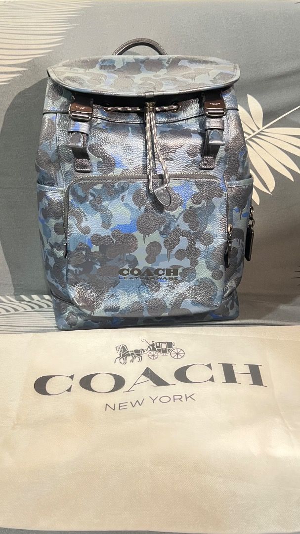 Coach Bag (Category: Luxury Bags & Wallets) located in Caloocan City. Submitted by garo1378 (Listing ID 1457779441, Image 3). Description: Good day! Wts I would like to request an online price assessment for my authentic Coach backpack. Here are the details:Model: Coach League Flap Backpack with Camo PrintMaterial: Polished Pebble LeatherCondition: Excellent condition, like new, and absolutely NO damage (clean interior and exterior).Inclusions: O