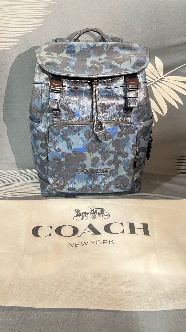 Coach Bag (Category: Luxury Bags & Wallets) located in Caloocan City. Submitted by garo1378 (Listing ID 1457779441, Image 1). Description: Good day! Wts I would like to request an online price assessment for my authentic Coach backpack. Here are the details:Model: Coach League Flap Backpack with Camo PrintMaterial: Polished Pebble LeatherCondition: Excellent condition, like new, and absolutely NO damage (clean interior and exterior).Inclusions: O