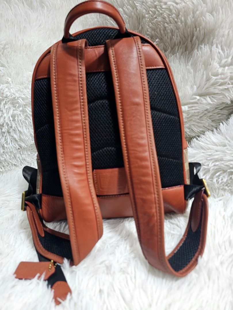Backpack Coach (Category: Luxury Bags & Wallets) located in Cavite. Submitted by liveriver_514fd1 (Listing ID 1457746000, Image 2). Description: - Authentic Coach Backpack bag - Signature canvas with brown leather trim - Convenient front zip pocket - Adjustable strap for a custom fit - Breathable padded mesh back panel - Ideal for everyday carry.