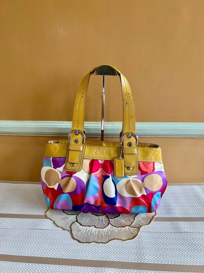 COACH Soho Multicolor Shoulder Bag (Category: Luxury Bags & Wallets) located in Quezon City. Submitted by bellafashion08 (Listing ID 1457867936, Image 1). Description: Dimension: - Height = 8 in. - Length = 12 in. * From U.S * Nice in actual Note: Please check all the photos carefully to see the issues with the bag.