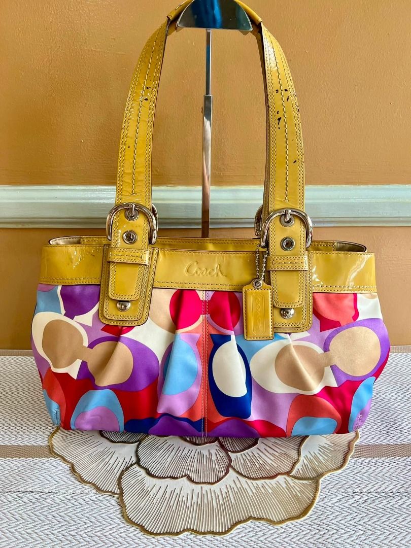 COACH Soho Multicolor Shoulder Bag (Category: Luxury Bags & Wallets) located in Quezon City. Submitted by bellafashion08 (Listing ID 1457867936, Image 3). Description: Dimension: - Height = 8 in. - Length = 12 in. * From U.S * Nice in actual Note: Please check all the photos carefully to see the issues with the bag.