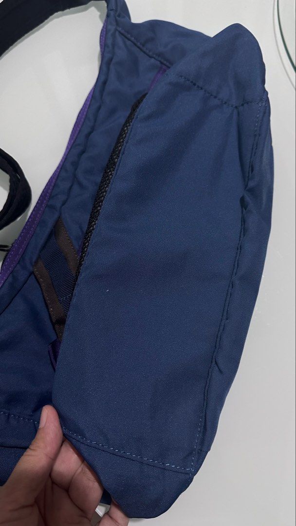 Columbia Blue Sling Bag (Category: Sling Bags) located in Mandaluyong City. Submitted by TheWeekendProject (Listing ID 1454166502, Image 3). Description: - Blue Columbia sling bag - Multiple zippered pockets on the front - Front mesh pocket - Adjustable strap - Ideal for everyday use or travel Issue: Peeling sa may front logo.