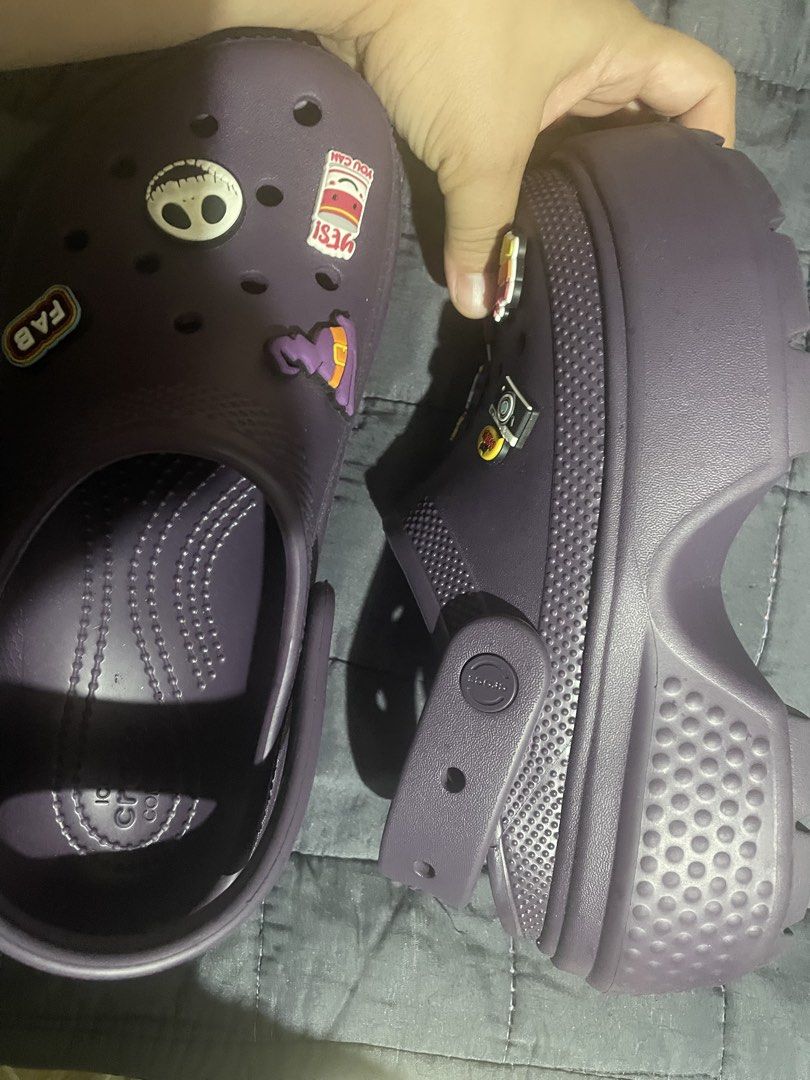 Crocs Classic Clogs (Category: Slippers and slides) located in Manila. Submitted by luna888elies888 (Listing ID 1457720338, Image 2). Description: These purple Crocs Classic Clogs are decorated with a fun assortment of colorful Jibbitz charms. Size W7 Good as new No issue (hindi lang nagamit once or twice lang) This version is the Crocs Classic Platform Clog, featuring a 1.6-inch (41 mm) elevated sole and a slimmer, sleeker look compared to stand