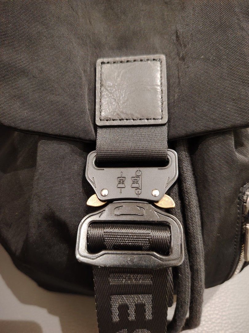 Diesel nylon backpack (Category: Luxury Bags & Wallets) located in Cavite. Submitted by missyfhey (Listing ID 1457728696, Image 2). Description: This is a sleek black nylon backpack by Diesel, featuring a distinctive metal buckle closure on the branded front strap. Dimensions: approximately 34 x 33 x 12 cm (depth)..