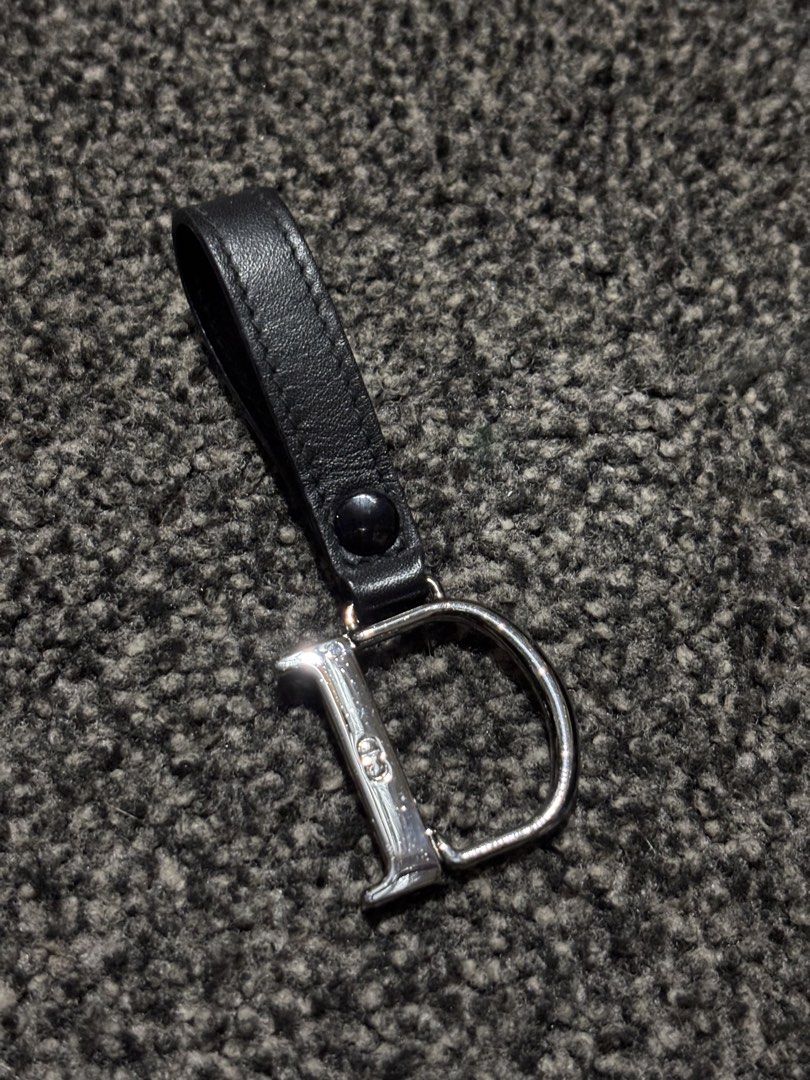 Dior Keychain (Category: Luxury Accessories) located in Bulacan. Submitted by thriftstarph (Listing ID 1457857384, Image 1). Description: PLEASE READ THE DESCRIPTION BELOW ‼️ Dior Keychain Leather Engraved Dior Logo From: Japan No Issue.