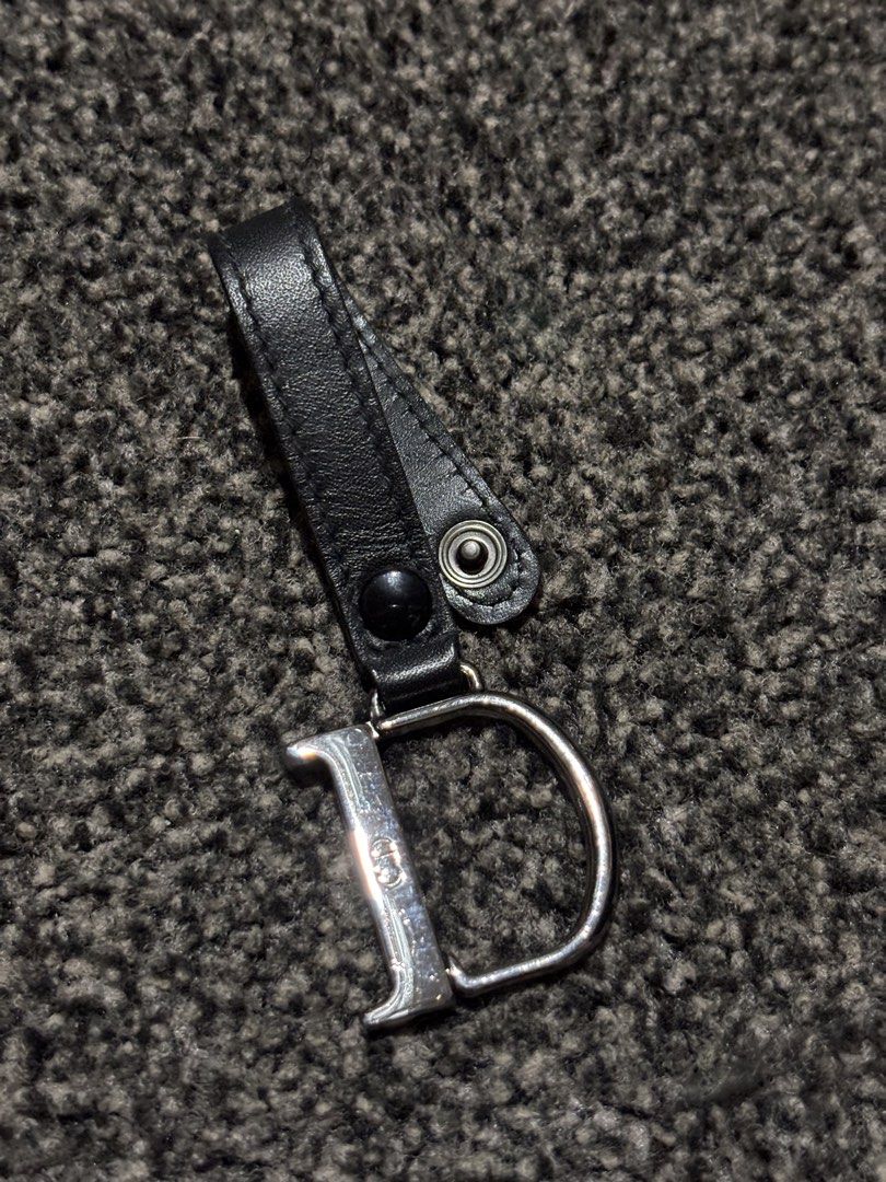 Dior Keychain (Category: Luxury Accessories) located in Bulacan. Submitted by thriftstarph (Listing ID 1457857384, Image 2). Description: PLEASE READ THE DESCRIPTION BELOW ‼️ Dior Keychain Leather Engraved Dior Logo From: Japan No Issue.