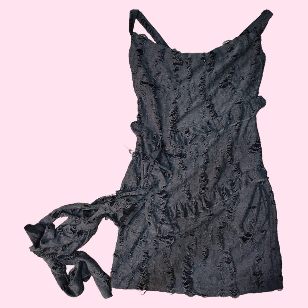 Distressed Black Mini Dress with Ruffles (Category: Dresses) located in Caloocan City. Submitted by faesrie (Listing ID 1457746613, Image 1). Description: - Black mini dress - Distressed, ripped design - Ruffled layers throughout - Spaghetti straps - Unique, edgy style - Ideal for parties or a night out - Eye-catching and daring design.