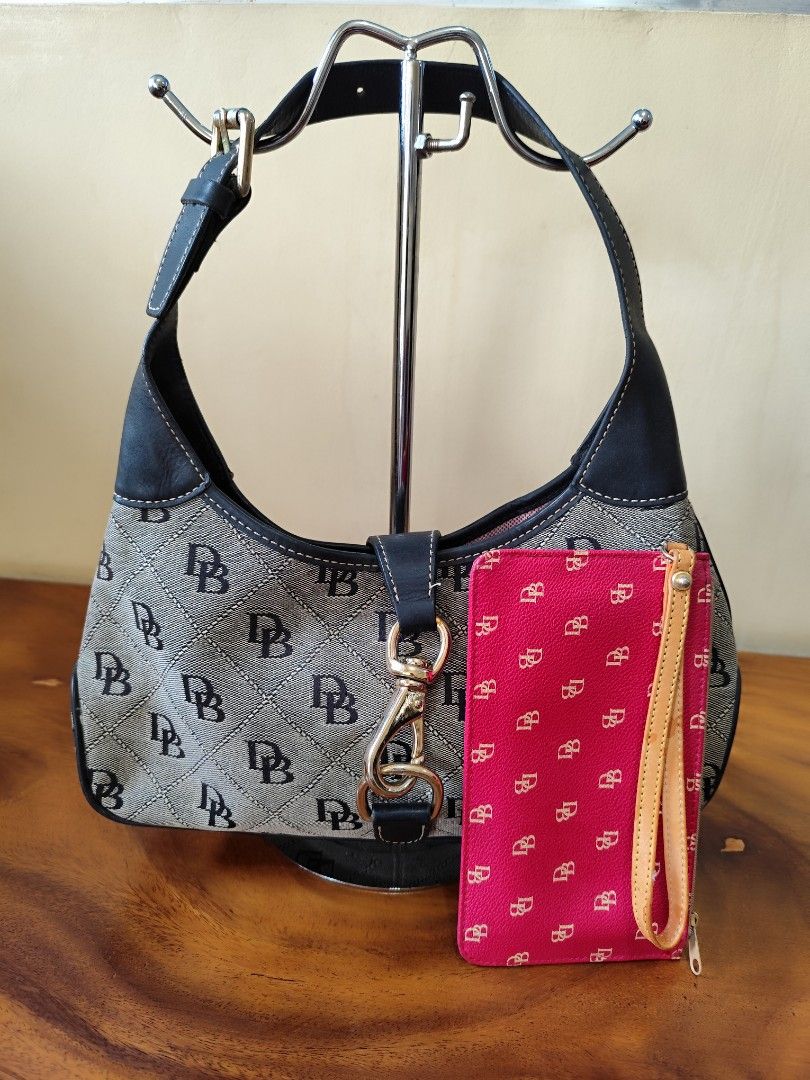 Dooney & Bourke Monogram Canvas Hobo Bag with Matching Pouch (Category: Luxury Bags & Wallets) located in Cabarroguis. Submitted by hutchenreuther (Listing ID 1457751501, Image 2). Description: Dooney & Bourke hobo bag both for P2500.00 (free sf via Flash Express) slightly used condition - Classic DB monogram canvas with black leather trim - Pink interior lining - Comes with a matching pink monogram pouch - Pouch has a wrist strap - Great for eve