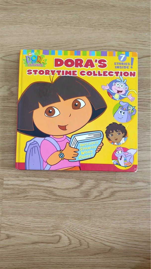 Dora's Story Time Collection Book - 7 Stories Inside (Category: Children's Books) located in Makati City. Submitted by adventuresofjujucloset (Listing ID 1457792022, Image 1). Description: - Collection of 7 Dora the Explorer stories - Features Spanish words, great for bilingual learning - Fun and engaging illustrations on every page - Ideal for young readers who love Dora - Perfect for bedtime stories.