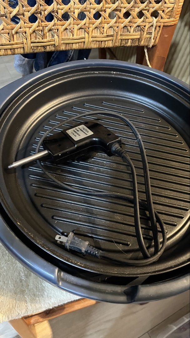 Dowell Hot Kitchen Electric Grill (Category: Cookware & Accessories) located in Pasig City. Submitted by tylernchloe (Listing ID 1457721885, Image 2). Description: - 220v 1300w - With glass lid - Adjustable temperature control - Raised grilling ridges for nice grill marks - Approx 35cm diameter - See pic for minor scratch on plastic - Easy to clean.