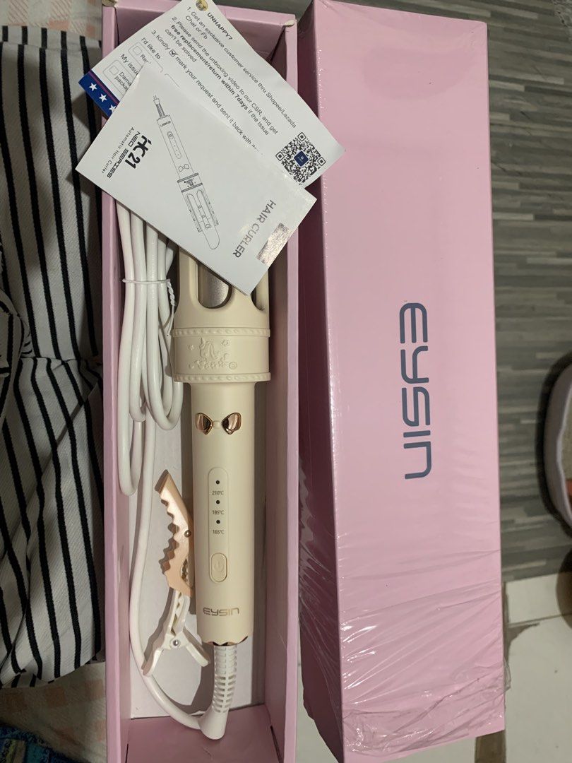 EYSIN HC21 Automatic Hair Curler (Category: Hair) located in Bulacan. Submitted by celinexxxbuyer (Listing ID 1457887473, Image 1). Description: - EYSIN HC21 Automatic Hair Curler - Color: Light Cream - Easy to create beautiful curls - Three adjustable heat settings: 165°C, 185°C, 210°C - Includes a convenient hair clip - Comes in attractive pink packaging -Brand new not used -Opened just for photo.