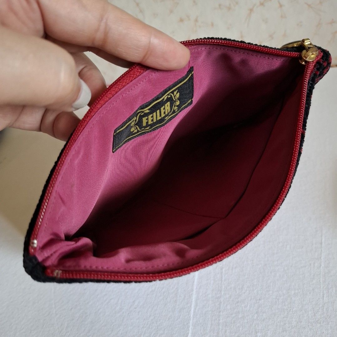 FEILER Black Red Rose Pouch (Category: Purses & Pouches) located in Don Carlos. Submitted by PphiXi_Finds (Listing ID 1457807778, Image 2). Description: - Cute FEILER pouch - Black background with vibrant red rose embroidery - Sparkly red accent details - Bright pink fabric lining inside - Secure zipper closure - Ideal for organizing small items or as a stylish pouch..