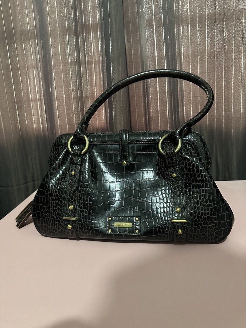 Fino Leatherware Bag (Category: Shoulder Bags) located in Rizal. Submitted by cruzj18 (Listing ID 1457815168, Image 2). Description: Beautiful, shiny crocodile leather bag from Fino Leatherware. Real , genuine leather Dark brown in color Can be carried as shoulderbag or handbag Shiny metal Fino plate with 1 zipper pocket and 4 open pocket inside This is so nice, looks brand new Clean, no odor All zippers working well.