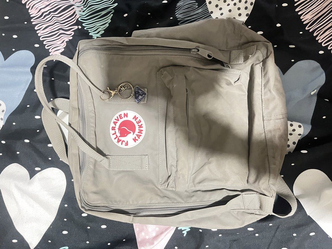 Fjallraven Kanken Backpack Grey (Category: Backpacks) located in Naga. Submitted by Carmel_C (Listing ID 1457862539, Image 1). Description: - Classic Fjallraven Kanken backpack - Color: Grey - Main compartment and front pocket - Zippers in good working condition - Adjustable straps for comfort - Features the iconic Fjallraven logo patch - Ideal for everyday use - Easily fits your daily essentials.