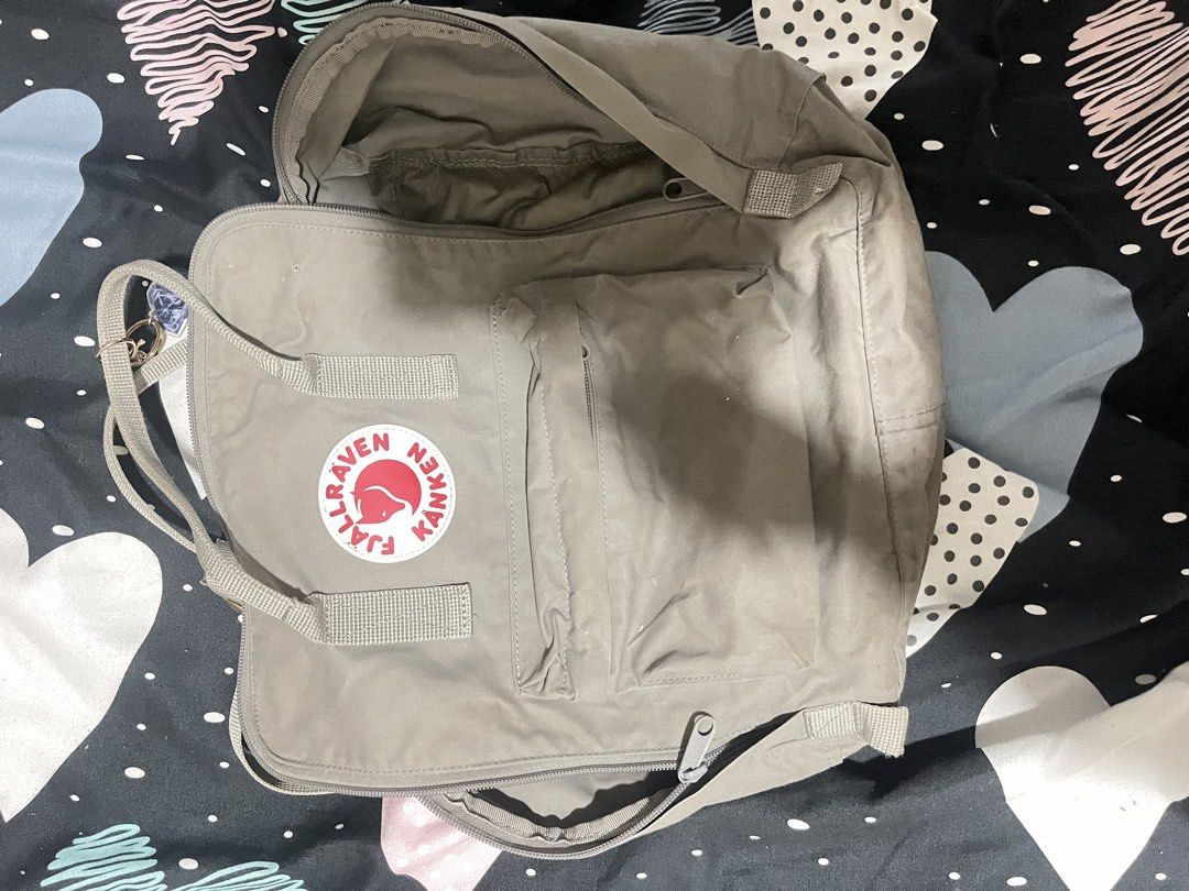 Fjallraven Kanken Backpack Grey (Category: Backpacks) located in Naga. Submitted by Carmel_C (Listing ID 1457862539, Image 2). Description: - Classic Fjallraven Kanken backpack - Color: Grey - Main compartment and front pocket - Zippers in good working condition - Adjustable straps for comfort - Features the iconic Fjallraven logo patch - Ideal for everyday use - Easily fits your daily essentials.