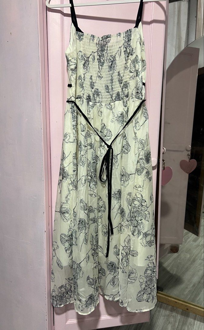 Floral Spaghetti Strap Midi Dress (Category: Dresses) located in Imus. Submitted by aydg_ (Listing ID 1457854947, Image 2). Description: - off white base color - floral print - Smocked yung back - Tie belt at the waist - Lightweight fabric - Ideal for warm weather, casual outings, or beach days.