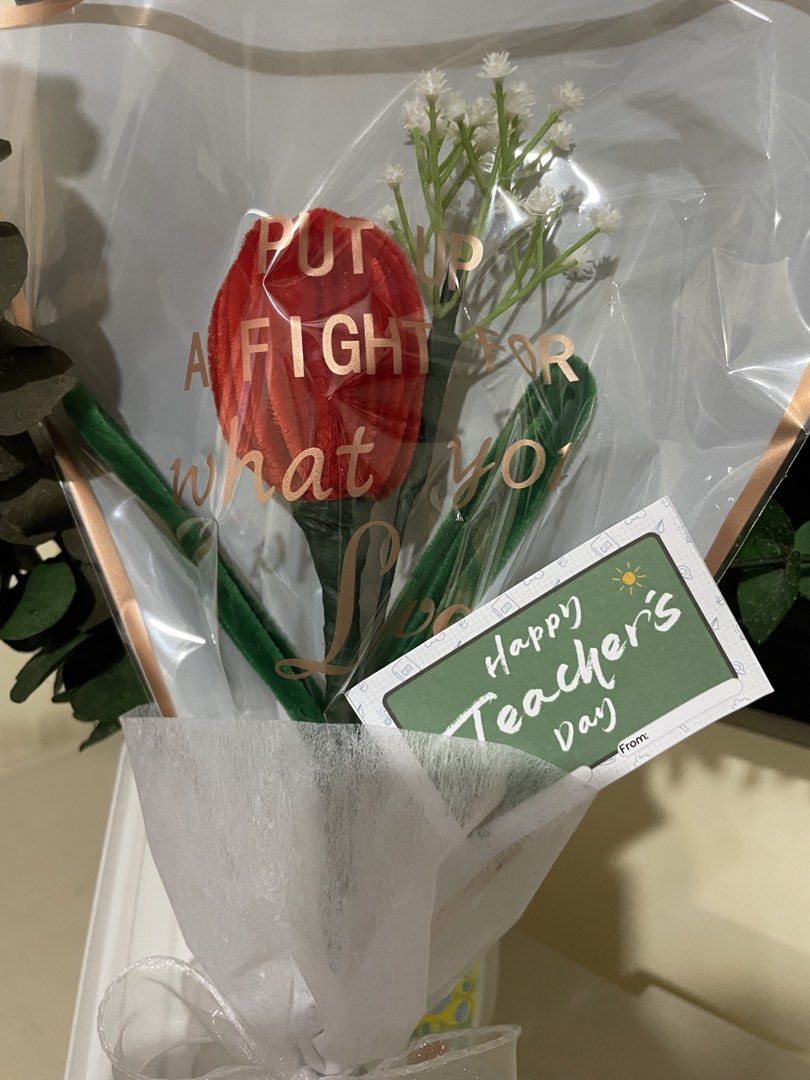 Flower Bouquets (Category: Flowers & Bouquets) located in Rizal. Submitted by arlynazanion16 (Listing ID 1457902159, Image 2). Description: The selected region appears to show a handcrafted single-flower bouquet made from red and green fuzzy wire (pipe cleaners), wrapped in clear and white translucent paper with a bright pink ribbon and a "Happy Teacher's Day" tag..