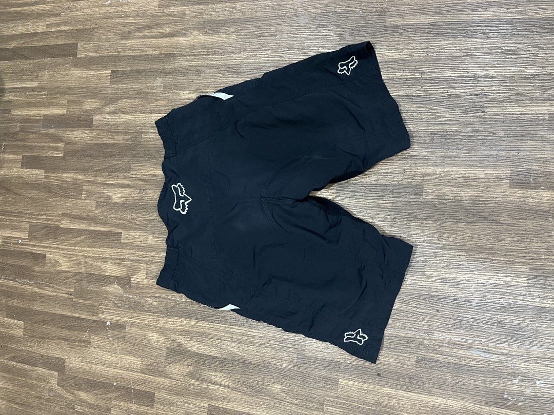 Fox Racing Black Cycling Shorts (Category: Activewear) located in Manila. Submitted by jortexxd (Listing ID 1457789554, Image 2). Description: - Brand: Black Fox Racing - Type: Cycling Shorts - Features: Zippered pocket (right side), elastic waistband with drawstring, Fox logo (front left leg & back right leg) - Accents: Light white details on waistband - Ideal for: Trail riding and cycling.