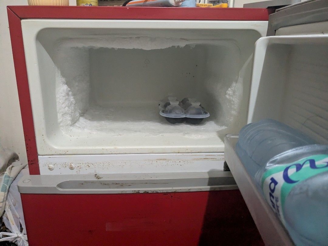 Fujidenzo Red Mini Refrigerator (Category: Refrigerators and Freezers) located in San Juan City. Submitted by dashofdashii (Listing ID 1457895270, Image 2). Description: - Red Fujidenzo mini fridge - Top freezer compartment - Main refrigerator compartment below - Minor wear on the door seal - Still fully functional - Ideal for dorm rooms or small living spaces - bought in 2019.