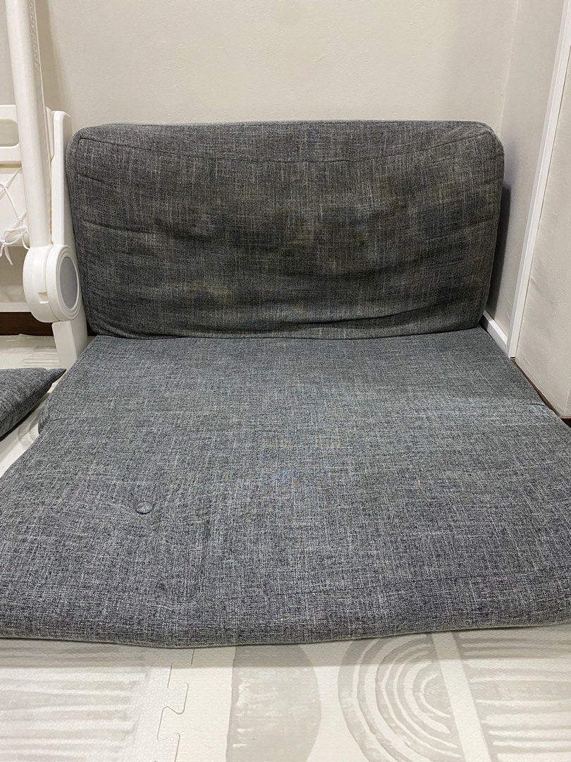 Gray Sofabed Foldable (185x90x25 cm) (Category: Sofas) located in Quezon City. Submitted by stoneyice (Listing ID 1457887256, Image 2). Description: - Foldable sofabed - Dimensions: 185x90x25 cm - Includes 2 pillows - Has stains, missing upholstery buttons - Otherwise, it still works and is still comfy - RFS: Upgrading to a bigger one - Either for pickup or book a big car to pick it up so it can fit.