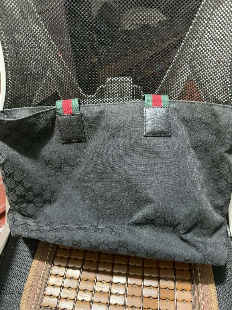 Gucci GG Monogram Canvas Tote Bag (Category: Luxury Bags & Wallets) located in Manila. Submitted by cruznarlyn63507 (Listing ID 1457846960, Image 3). Description: - Authentic Gucci tote bag - Black GG monogram canvas - Iconic red and green stripe detail on handles - Spacious interior for essentials - Ideal for everyday use - Serial number visible in photos.