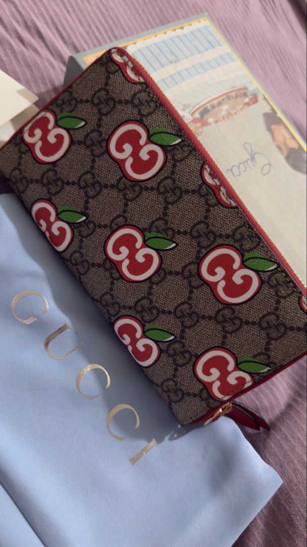 Gucci GG Supreme Cherry Zip Around Wallet (Category: Luxury Bags & Wallets) located in Manila. Submitted by mschasaha60513 (Listing ID 1457732960, Image 3). Description: - Authentic Gucci GG Supreme canvas wallet - Adorable cherry print - Red leather trim and interior - Multiple card slots and compartments for organization - Comes with original dust bag and box.