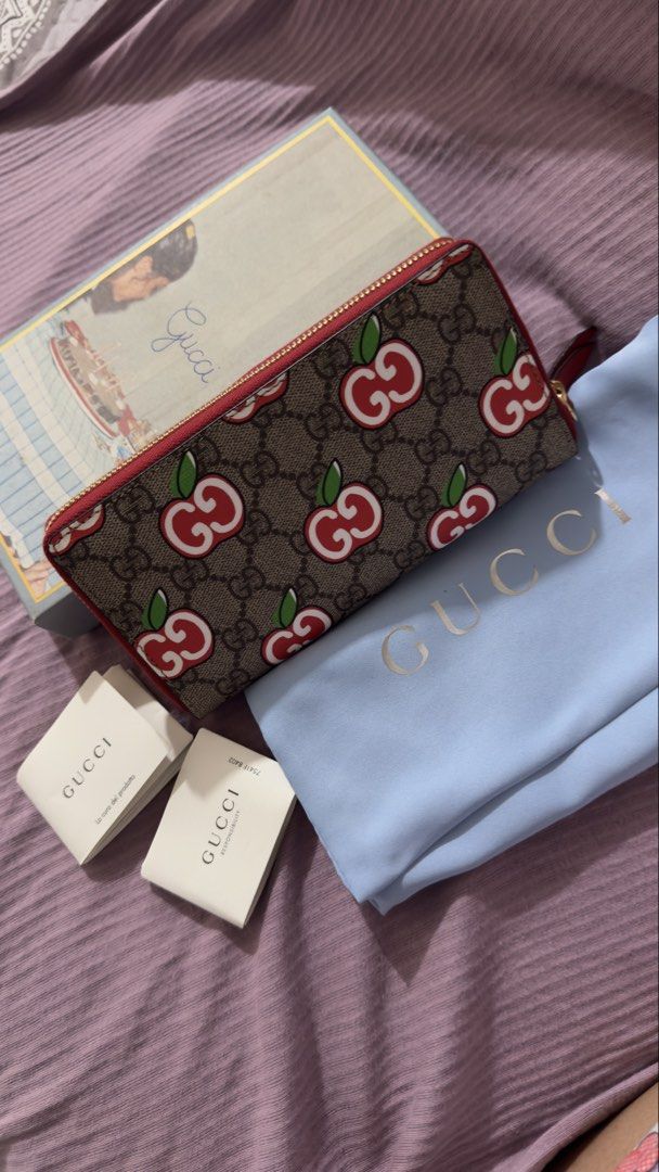 Gucci GG Supreme Cherry Zip Around Wallet (Category: Luxury Bags & Wallets) located in Manila. Submitted by mschasaha60513 (Listing ID 1457732960, Image 1). Description: - Authentic Gucci GG Supreme canvas wallet - Adorable cherry print - Red leather trim and interior - Multiple card slots and compartments for organization - Comes with original dust bag and box.