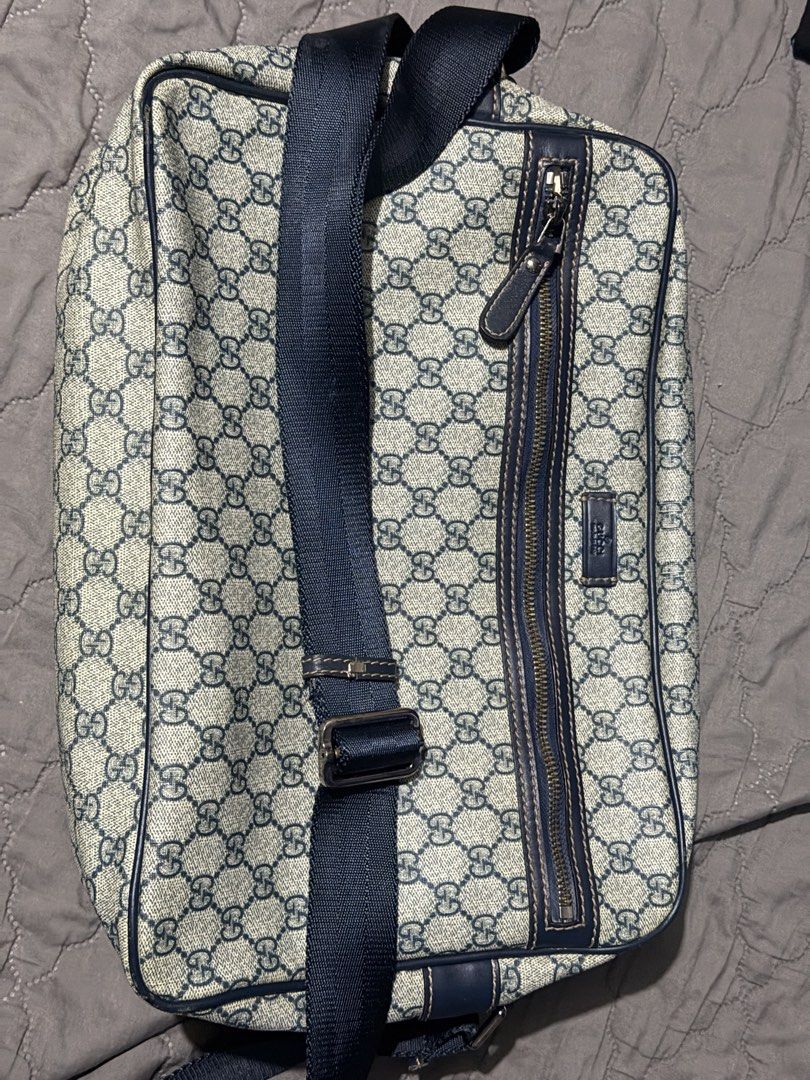 Gucci GG Supreme Monogram Sling Bag (Category: Luxury Bags & Wallets) located in San Mateo. Submitted by genx13 (Listing ID 1457845271, Image 1). Description: -Gucci sling bag - Classic GG monogram pattern - Navy blue leather trim and strap - Zipper closure - Adjustable strap for comfort - Great for everyday use.
