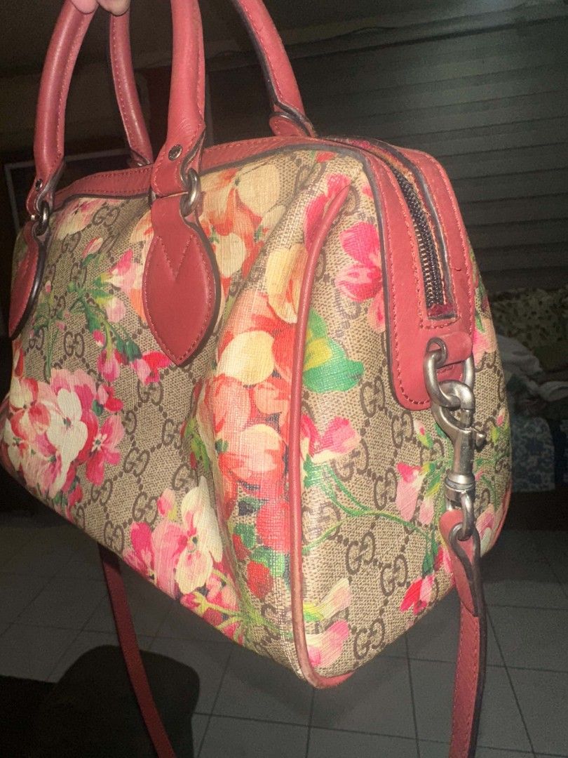 Gucci Monogram Floral Boston Bag (Category: Luxury Bags & Wallets) located in Manila. Submitted by vasttree.6bc15f (Listing ID 1456560619, Image 3). Description: - Gucci Boston Bag - Classic GG monogram with vibrant floral print - Red leather handles and strap - Versatile: can be worn as crossbody or shoulder bag - Secure zipper closure - Ideal for everyday use or travel.