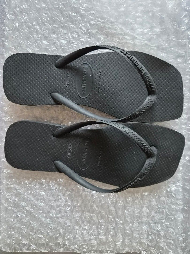 Havaianas x Zara flipflops (Category: Slippers and slides) located in Las Pinas. Submitted by storage485 (Listing ID 1457857663, Image 1). Description: - black Havaianas flip flops - Size: 37/38 - Classic design with textured sole - Features Havaianas logo on straps - Perfect for casual wear - Selling as they are no longer needed.
