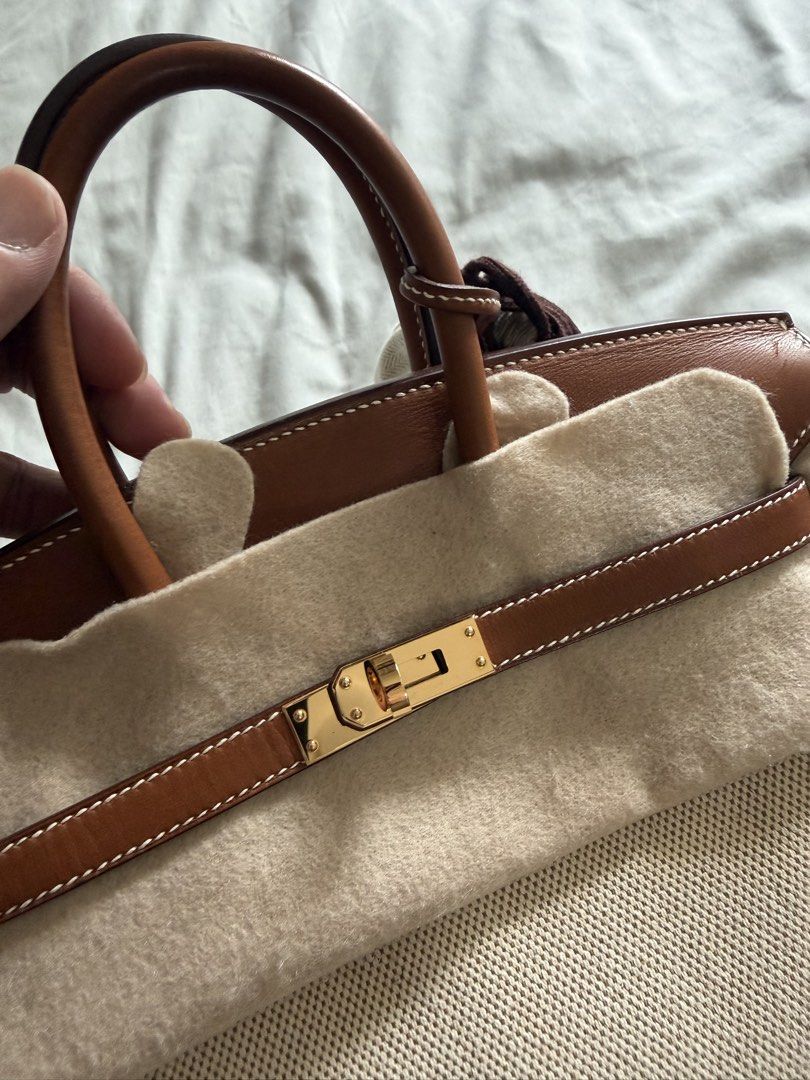 Hermès Birkin 25 Toile H (Category: Luxury Bags & Wallets) located in Manila. Submitted by baggaboi (Listing ID 1457865852, Image 3). Description: Birkin 25 Toile H Barenia Leather Fauve/ Ecru Gold Hardware inclusion Dustbag Strong Leather smell of Barenia.