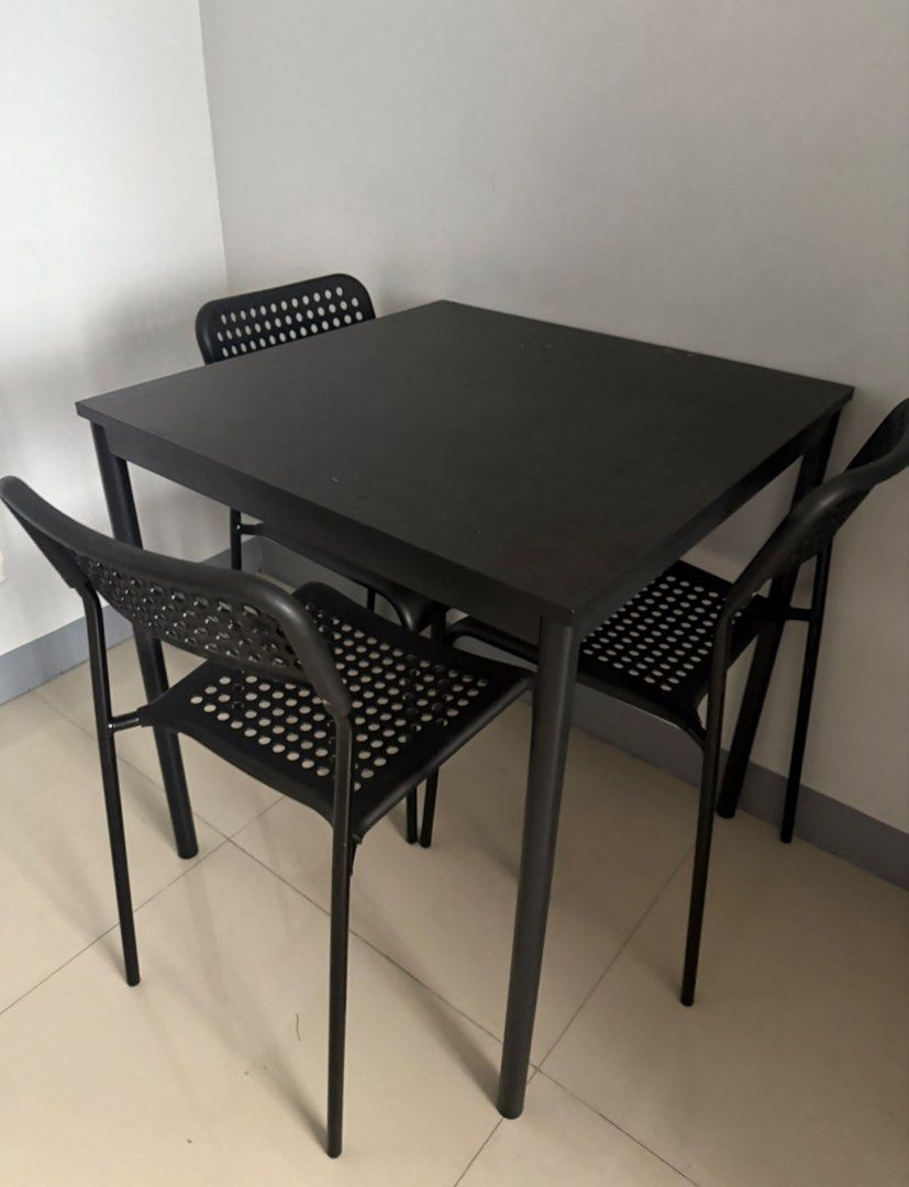 Ikea Dining Table & 3 chairs (Category: Tables & Sets) located in Batangas. Submitted by gaprelovedthings (Listing ID 1457901264, Image 3). Description: - Sleek black dining table and 3 chairs - Chairs feature a stylish perforated design - Ideal for small spaces, dining nooks, or kitchen areas - Simple, modern aesthetic - Easy to clean and maintain.