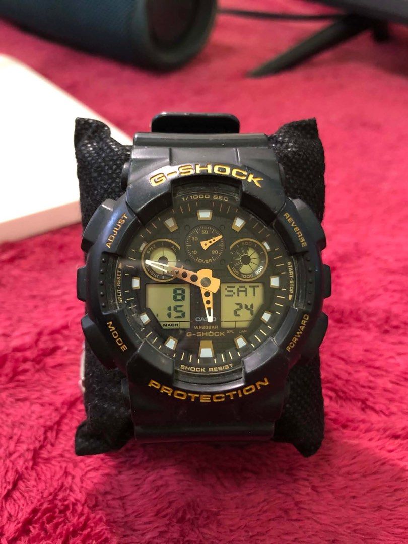 Casio G-Shock GA-100GBX-1A9 (Category: Men's Watches) located in Rodriguez. Submitted by gentlecloud.6f4dfa (Listing ID 1457884665, Image 1). Description: - Black G-Shock watch - Gold accent details - Shock resistant - WR20BAR water resistance - Digital display (time, date, day) - Stopwatch function - Durable and reliable for everyday wear.