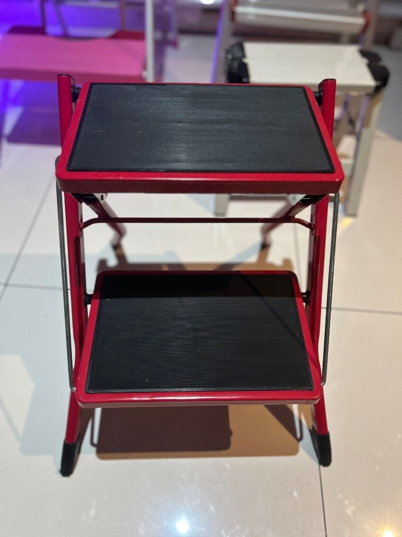 JAPAN Red 2-Step Folding Step Stool 16” Ladder (Category: Chairs) located in Las Pinas. Submitted by rusc.rusc (Listing ID 1457861799, Image 1). Description: JAPAN Red 2-Step Folding Step Stool 16” Ladder VG condition Las Pinas near City Hall - Sturdy red 2-step folding step stool - Black anti-slip treads for safety - Folds flat for convenient storage - Ideal for reaching high shelves - Can also be used as a small seat - Durable metal constructio
